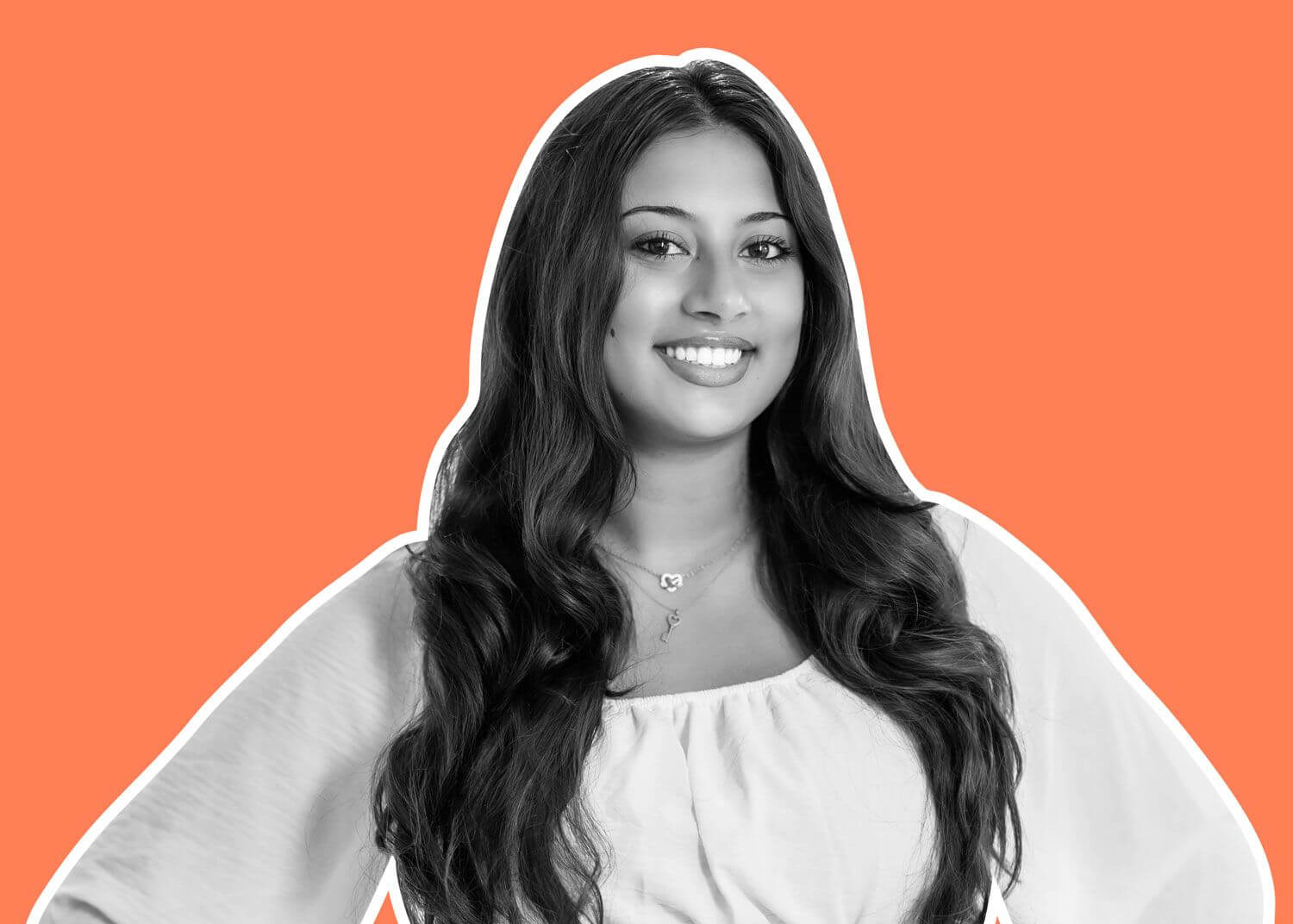 A woman with long wavy hair, wearing a light-colored off-shoulder top, smiles confidently. The black and white photo with a white outline pops against an orange background, reflecting the spirit of global education for girls on our urban campus Toronto.