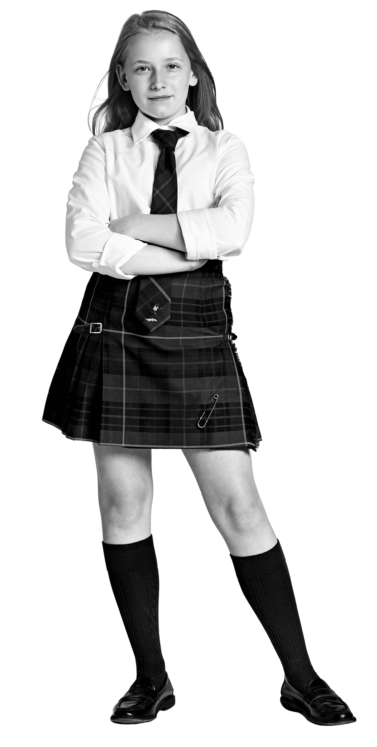 A girl stands confidently with arms crossed, wearing a school uniform: white shirt, plaid skirt, tie, knee-high socks, and loafers. She has long hair and looks directly at the camera.