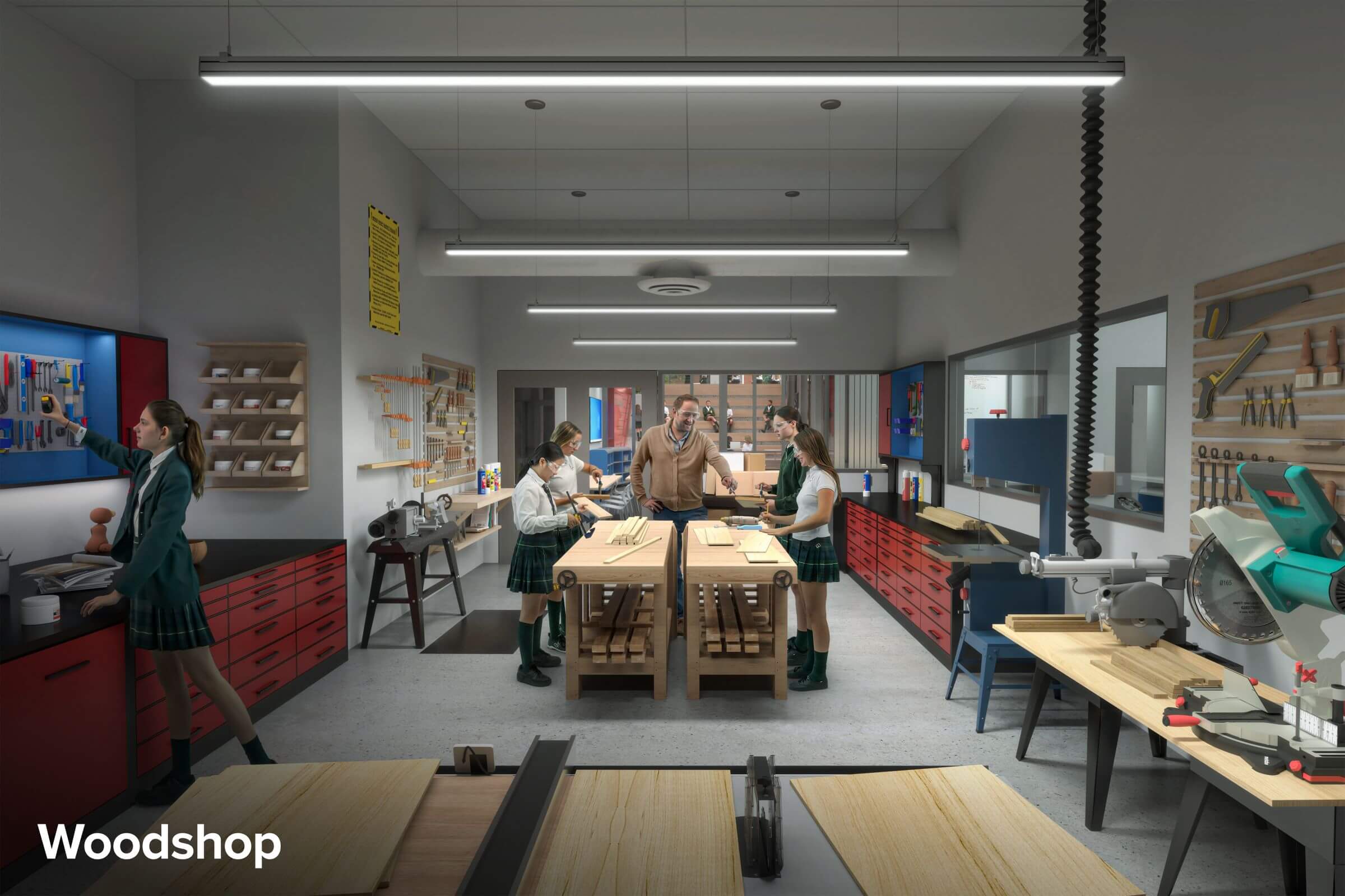 A teacher instructs four students in a well-equipped woodshop. The room features workbenches, various woodworking tools, cabinets, and bright overhead lighting. The students wear uniforms and listen attentively.