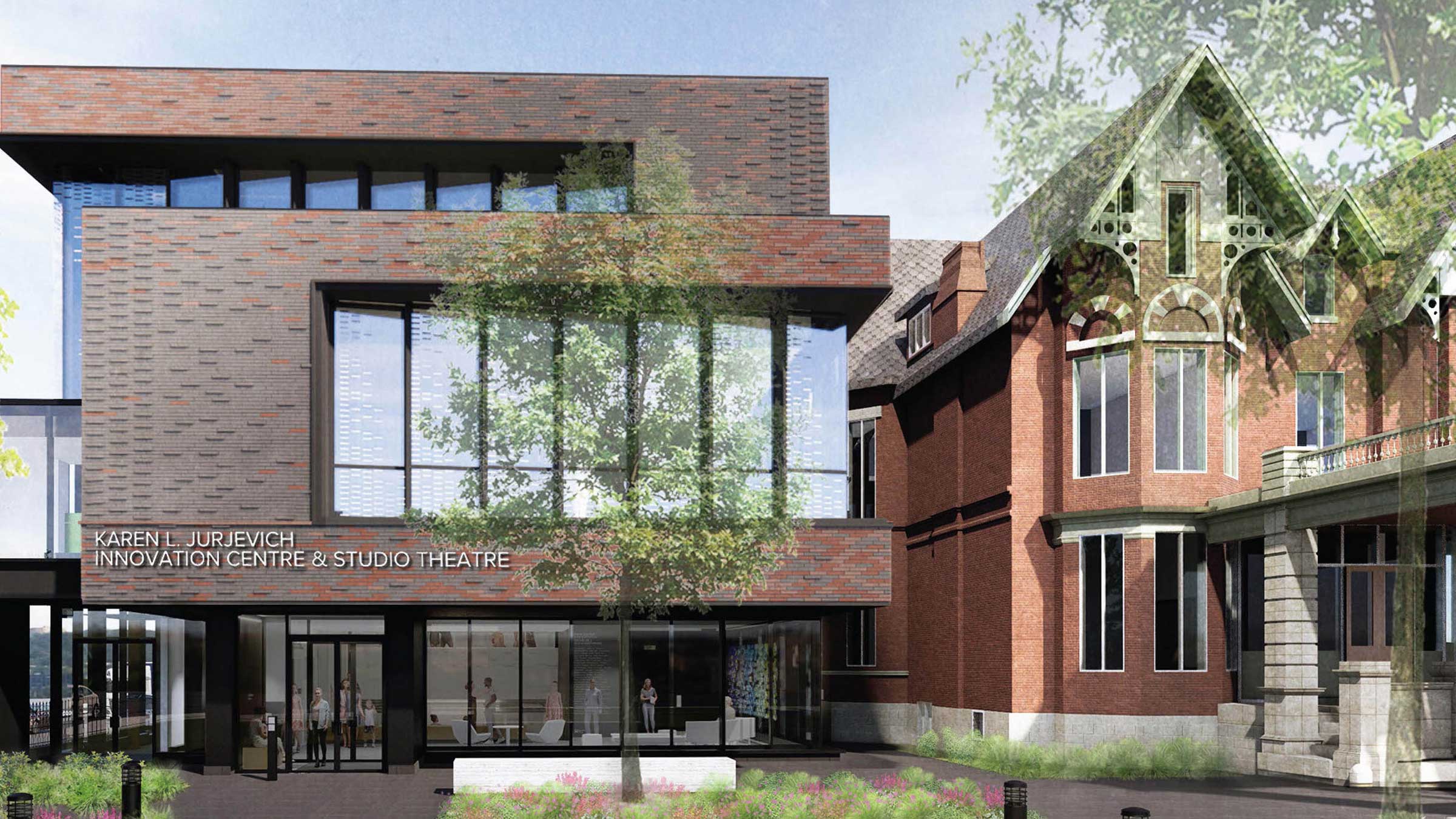 Modern brick and glass building labeled "Karen Lijunovich Innovation Centre & Studio Theatre" is attached to an older, ornate brick building with large windows and gothic-style details. Trees and sky are in the background.